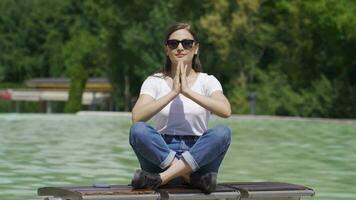 Woman meditates, relaxes, calms down. video