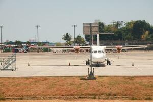 Makassar, Indonesia  September 21th 2023, An  aircraft from the Indonesian airline Lion Air is parked in apron and unloaded at Sultan Hasanuddin International Airport, Makassar. photo