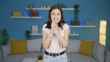 Young woman clapping excitedly to camera. video