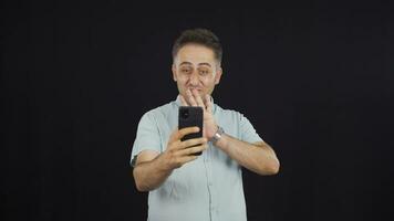 Man making a video call on the phone.