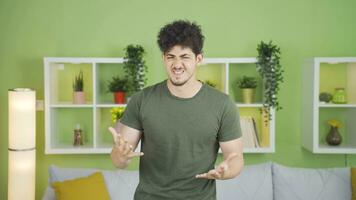 Portrait of young man who is aggressive and having a nervous breakdown. video