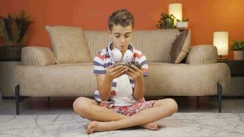 Boy watching videos with information and useful content.