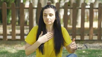 Woman with shortness of breath outdoors. video