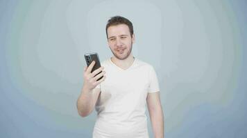 Man making a video call on the phone.