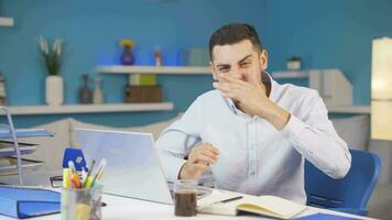 Home office worker man looks at camera with happy and smiling face. video