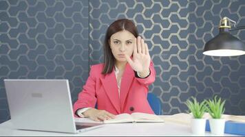 Young business woman saying stop to camera. video