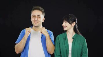 Couple making a sign of confidence at the camera. Confidence message. video