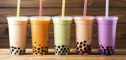 Plastic cups of different tasty bubble tea on wooden background. Generative AI photo