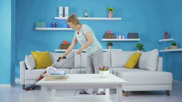 The woman sweeping the house. video