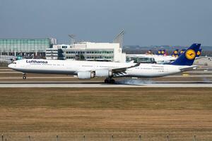 Lufthansa passenger plane at airport. Schedule flight travel. Aviation and aircraft. Air transport. Global international transportation. Fly and flying. photo