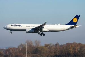 Lufthansa passenger plane at airport. Schedule flight travel. Aviation and aircraft. Air transport. Global international transportation. Fly and flying. photo