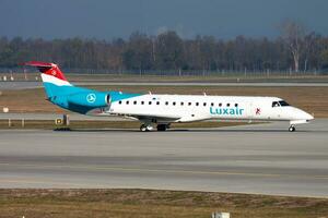 Luxair passenger plane at airport. Schedule flight travel. Aviation and aircraft. Air transport. Global international transportation. Fly and flying. photo
