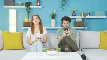 The couple who put down the phones are chatting. Phone addiction. video