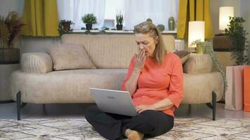 Woman closing laptop with angry expression. video