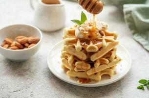 Belgian waffles with fruit, bananas and honey. Homemade baking. photo