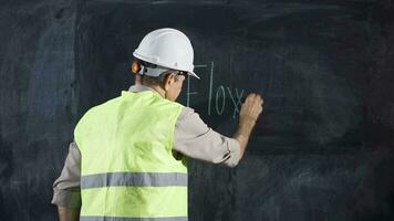 Engineer man writes Current on the board. video