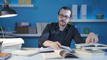 Portrait of young historian reading the book about the middle ages. video