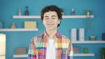 Cheerful and happy boy laughs looking at camera. video