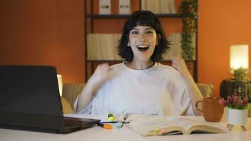 Female student experiencing joy looking at camera. video