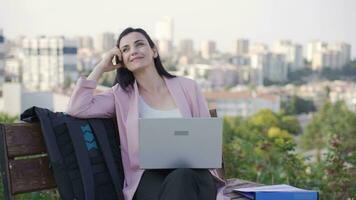 Businesswoman daydreaming outdoors in the park. video