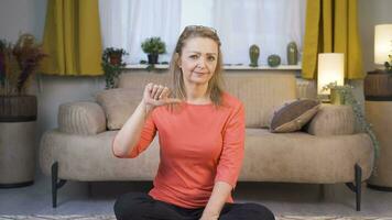 Woman looking at camera with a negative expression. video