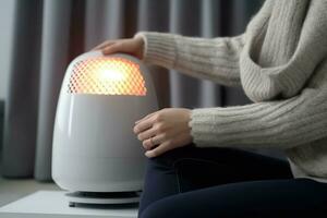 Woman warming hands near heater on floor. Generate Ai photo