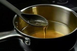 Saucepan and ladle with used cooking oil household. Generate Ai photo