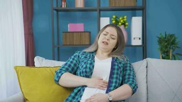 Woman experiencing stomachache. video