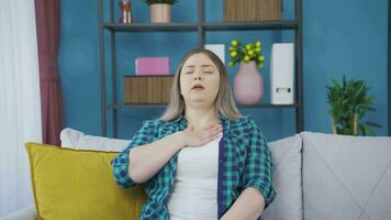 Woman with shortness of breath is breathing hard. video