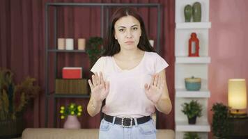 The woman who says calm down looking at the camera smiles. video