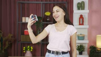 Woman looking happy at phone with Green Screen. video