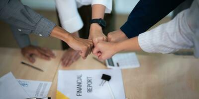 Hands, fist bump and business people, mission and collaboration with support, target goals and closeup. Meeting, team building and agreement, teamwork and plan together with community and partnership photo