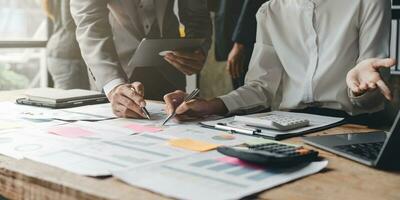 business adviser meeting to analyze and discuss the situation on the financial report in the meeting room.Investment Consultant, Financial advisor and accounting concept photo