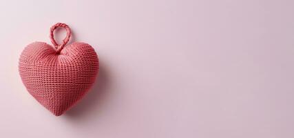 Banner with knitted heart on pik background ai created photo