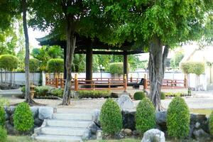 Ancient Asian traditional gazebo pavilion in the park photo