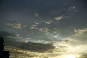 dark blue cloud with white light sky background and city light midnight evening time photo