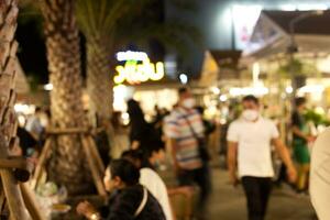 blur shopping in the night market country city photo