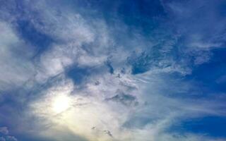 Blue sky with chemical chemtrails cumulus clouds scalar waves sky. photo