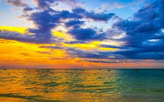 Awesome sunset at tropical Caribbean beach Playa del Carmen Mexico. photo