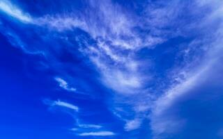 Blue sky with chemical chemtrails cumulus clouds scalar waves sky. photo