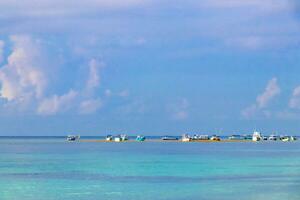 Boats yachts ship catamaran jetty beach Playa del Carmen Mexico. photo