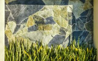 Texture detail of wall with rocks stones brick bricks Mexico. photo