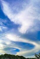 Blue sky with chemical chemtrails cumulus clouds scalar waves sky. photo