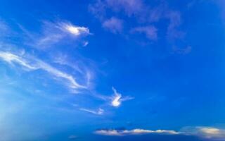 Blue sky with chemical chemtrails cumulus clouds scalar waves sky. photo