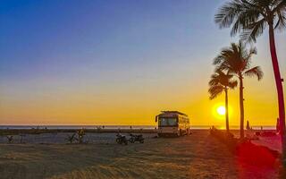 Camper bus car at sunset in Puerto Escondido Oaxaca Mexico. photo