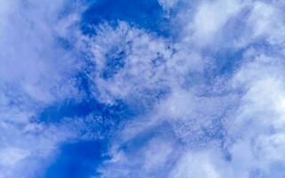 Blue sky with chemical chemtrails cumulus clouds scalar waves sky. photo