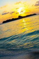Kuramathi Maldives tropical paradise island sunset view from Rasdhoo. photo