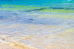 Waves at tropical beach caribbean sea clear turquoise water Mexico. photo