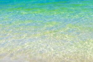 Waves at tropical beach caribbean sea clear turquoise water Mexico. photo