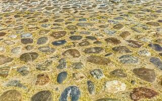 Texture detail of wall with rocks stones brick bricks Mexico. photo